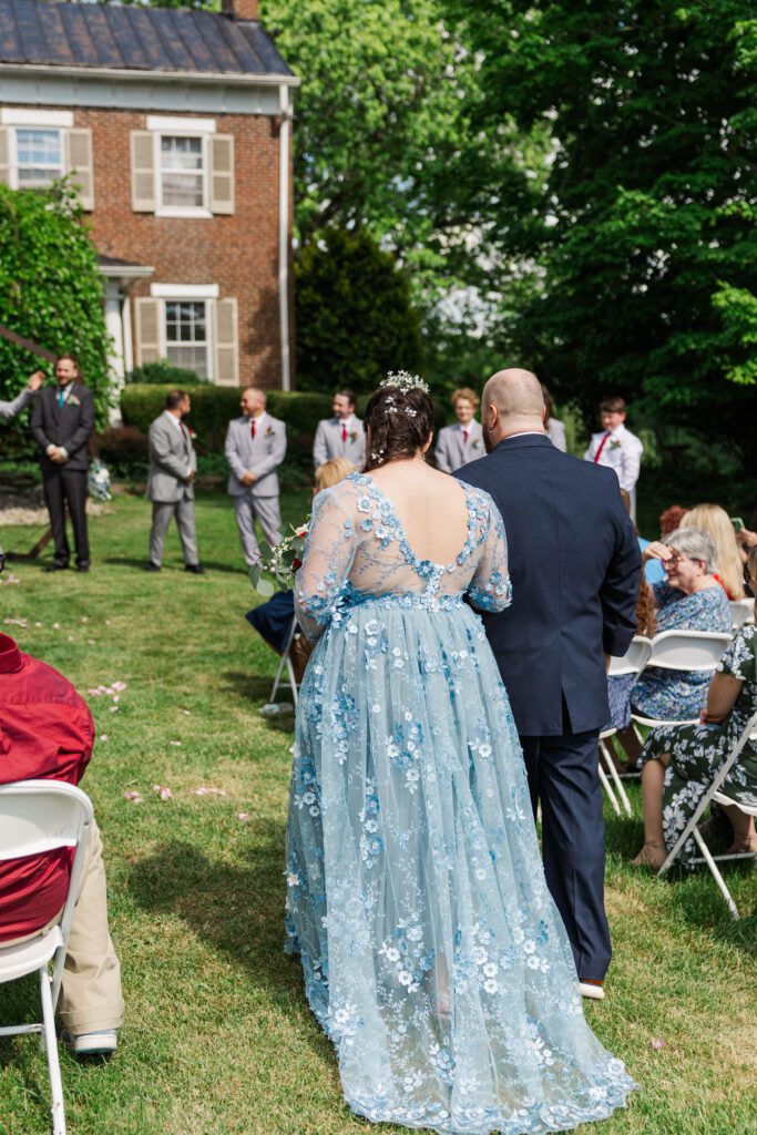 Bride and her father walk down the aisle at a Kentucky wedding. 