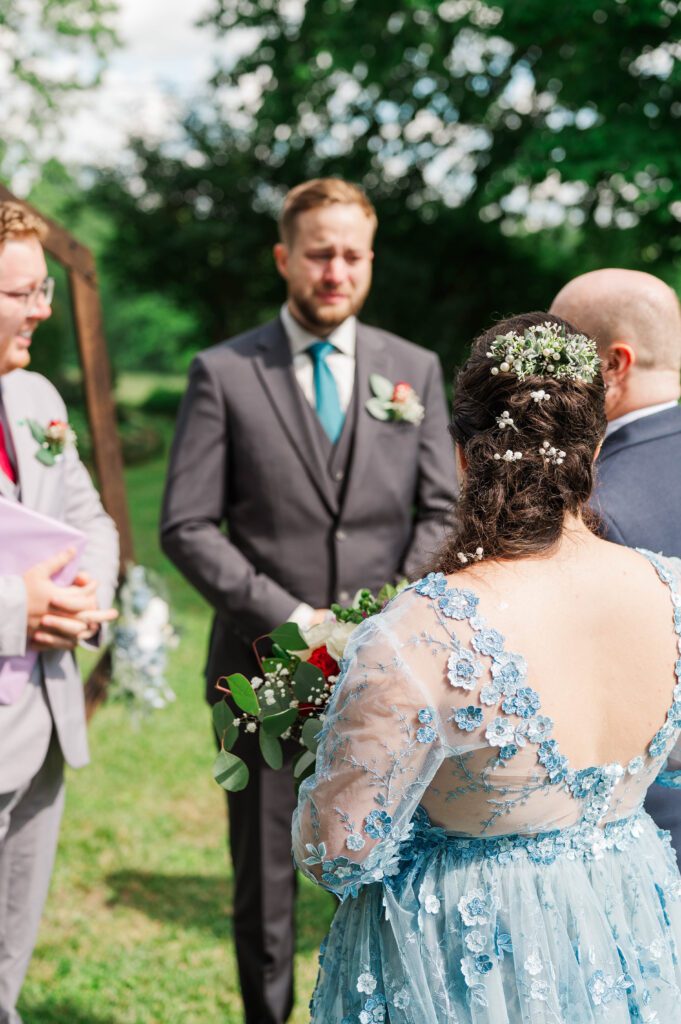 Groom gets emotional seeing the bride walk down the aisle at a Taylorsville, Kentucky wedding. 