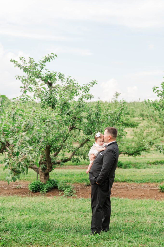 Groom holds his daughter, ready to walk down the aisle for his wedding near Lexington, KY