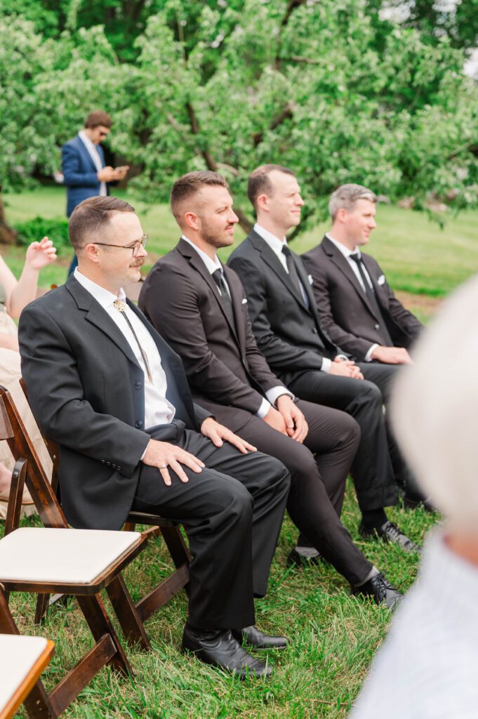 Groomsmen watch wedding ceremony near Lexington, KY