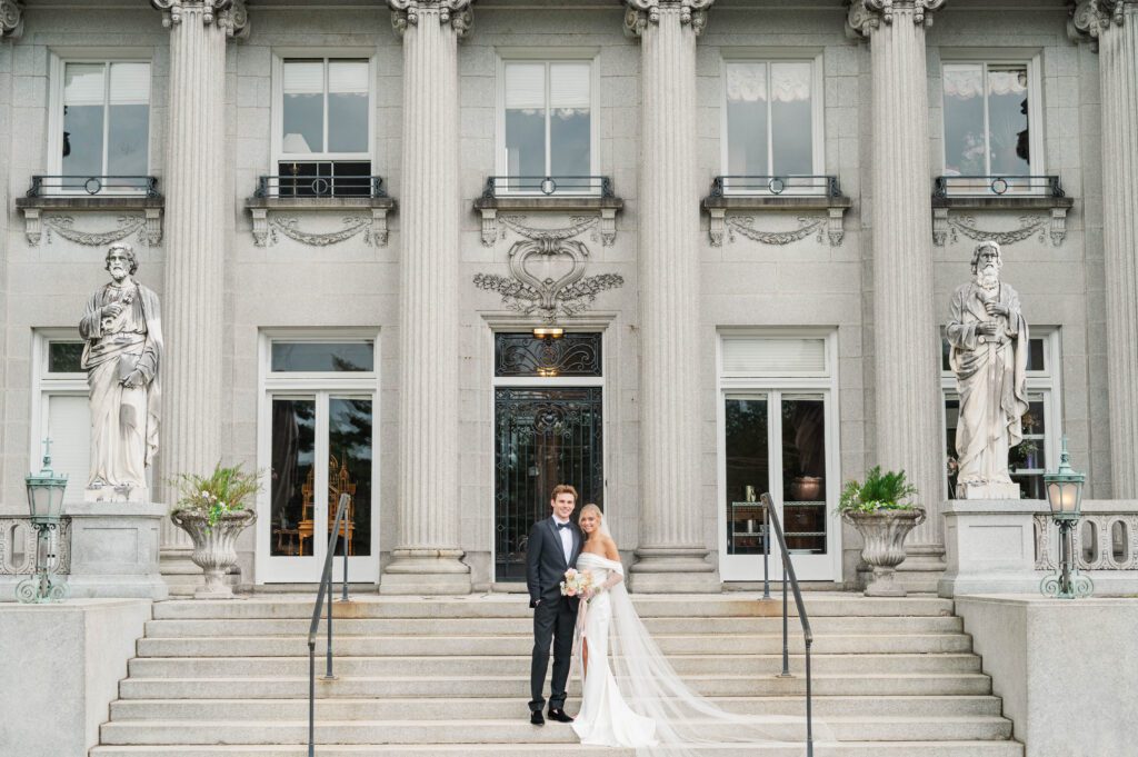 Bride and groom pose in front of Laurel Court on their wedding day in Cincinnati