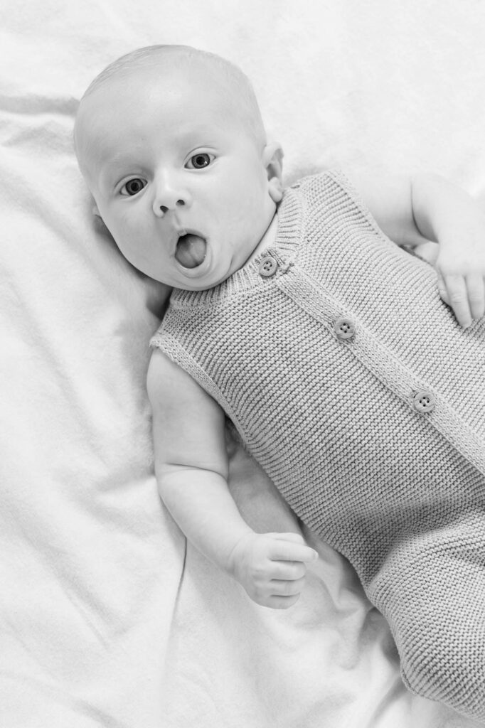 Baby plays on the floor for in-home family session in Louisville, KY