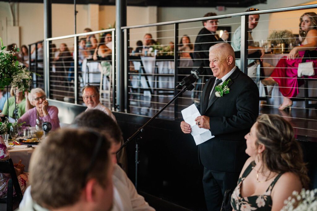 Dad giving a speech at the reception of a wedding day