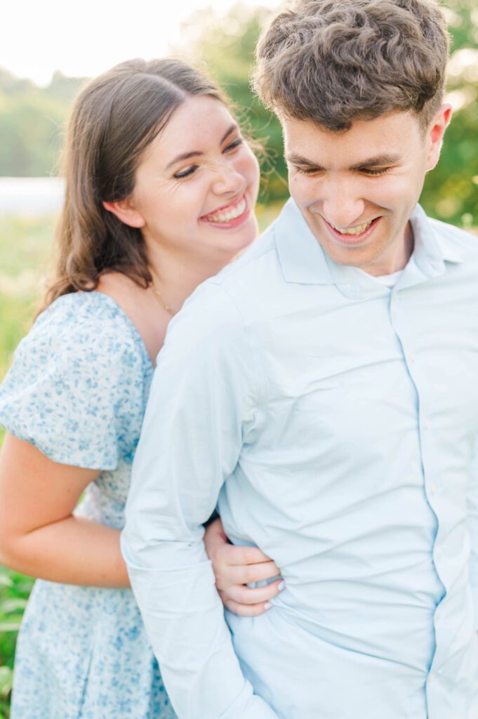 Couple stands together in a field of wildflowers at Beckley Creek Park for their Louisville engagement session.