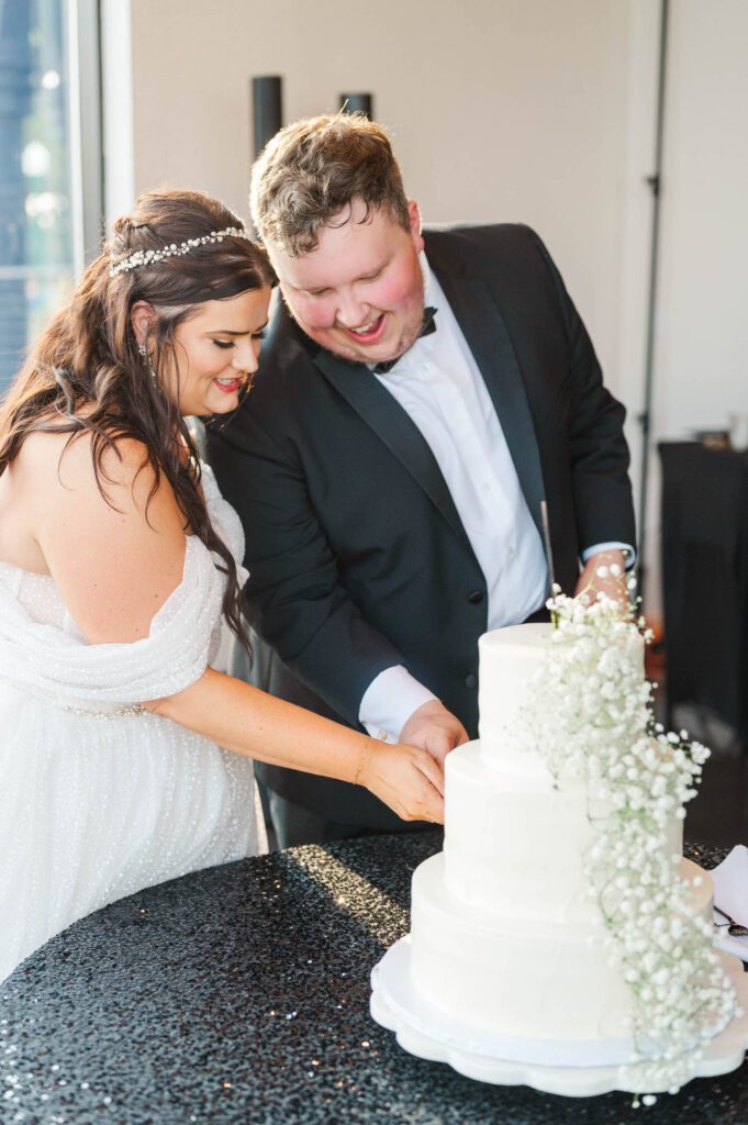 Bride and groom cut the cake on their wedding day at The Jefferson