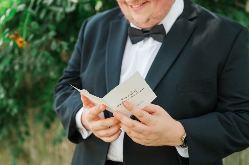 Groom reading a note from his future bride bride