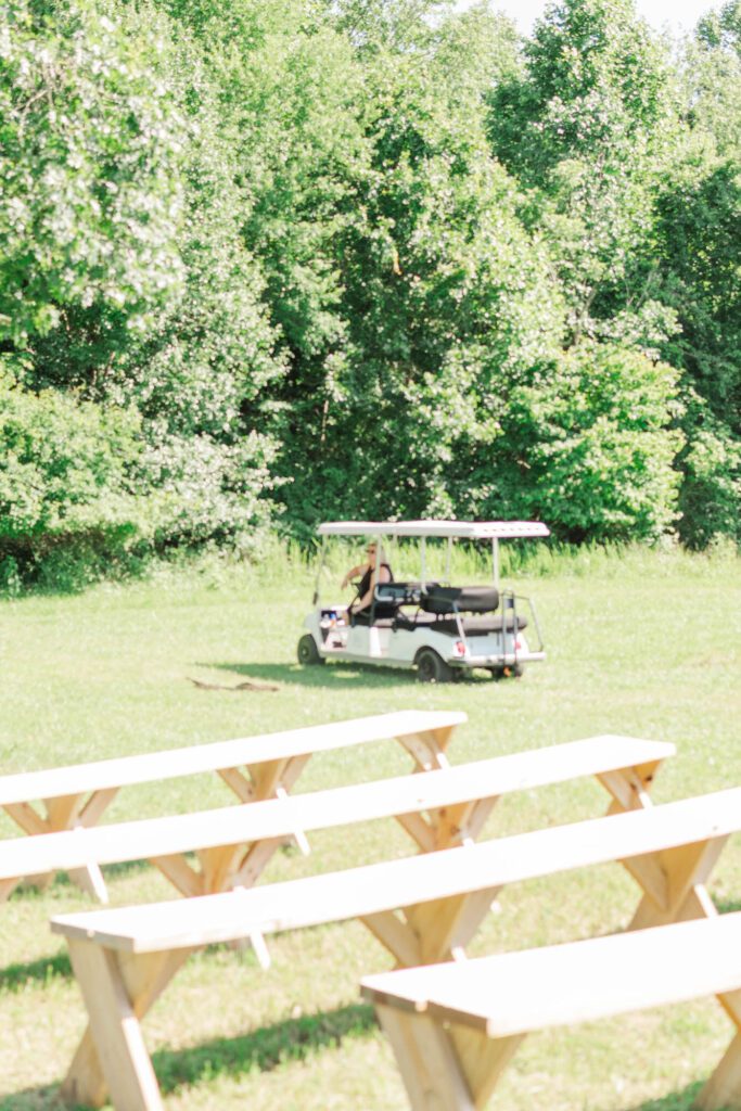 Owner Joy drives the golf cart at the Kentucky wedding venue Cornerstone Acres