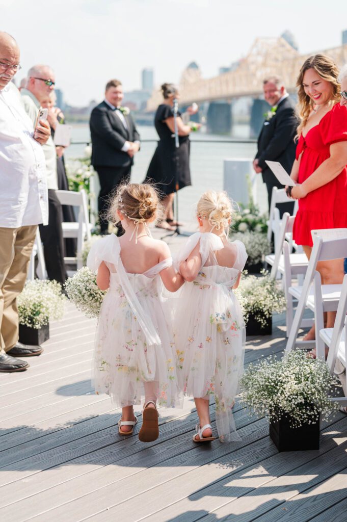 Flower girls walking down the aisle