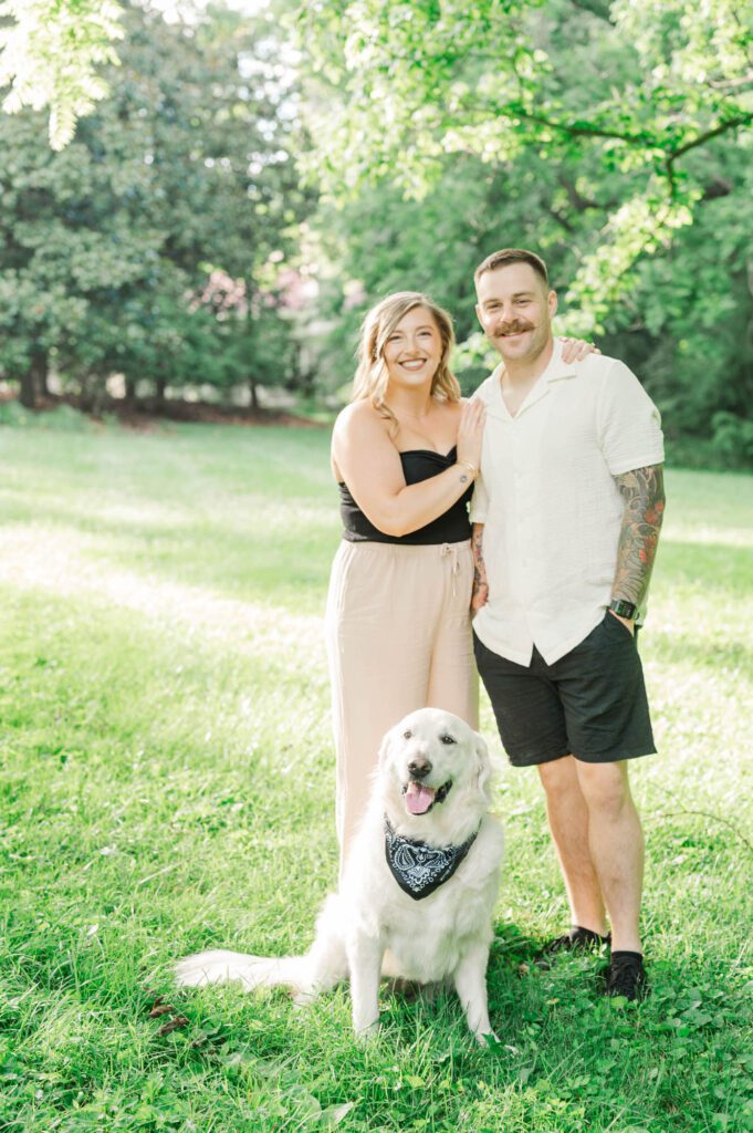 Couple poses with their dog for their couples session in Louisville, KY