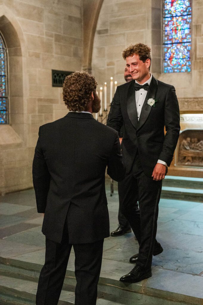 Groom shakes best man's hand before the ceremony