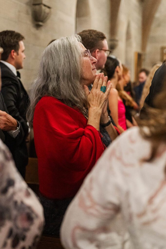 Family member tears up watching the bride walk down the aisle