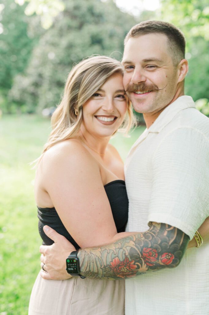 Couple smiles at the camera for their couples session in Louisville, KY