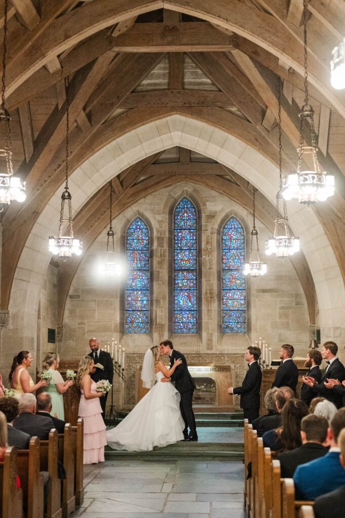 Bride and groom kiss as they are married at the Duncan Memorial Chapel in Louisville, Kentucky