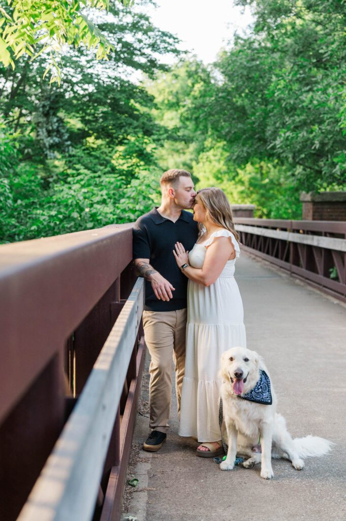 A Louisville couple shares a moment with their dog during their photo session