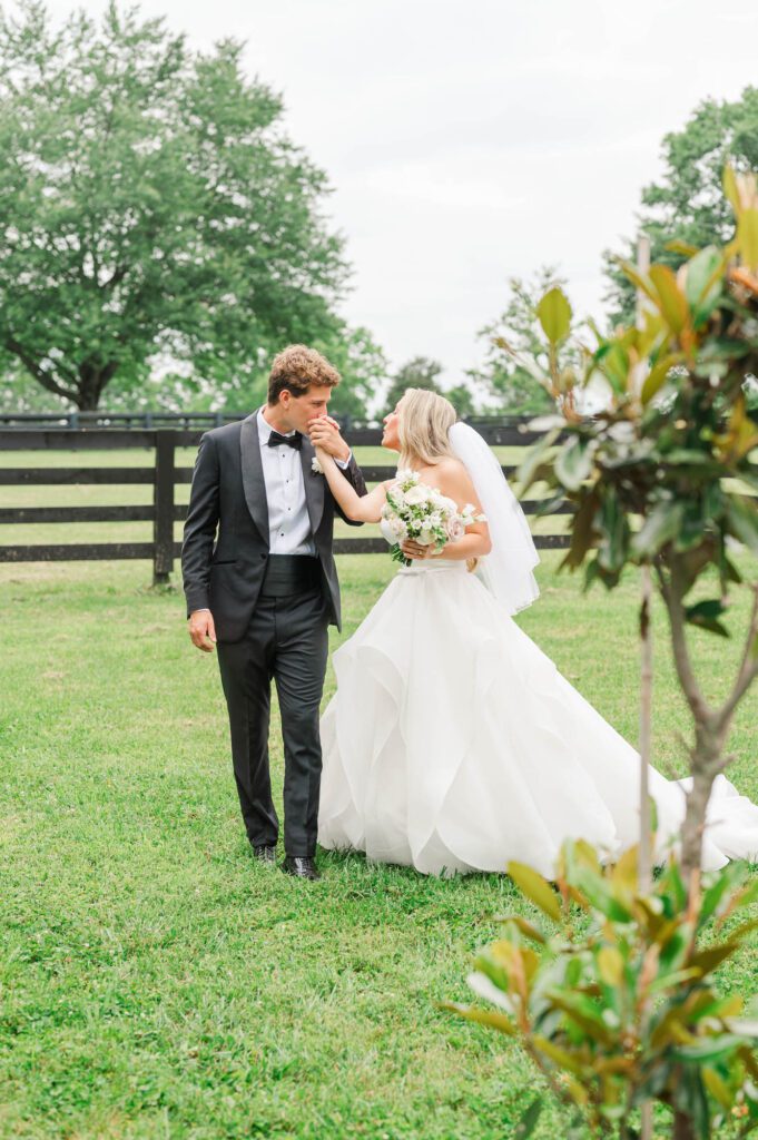 Couple walks hand in hand on their wedding day