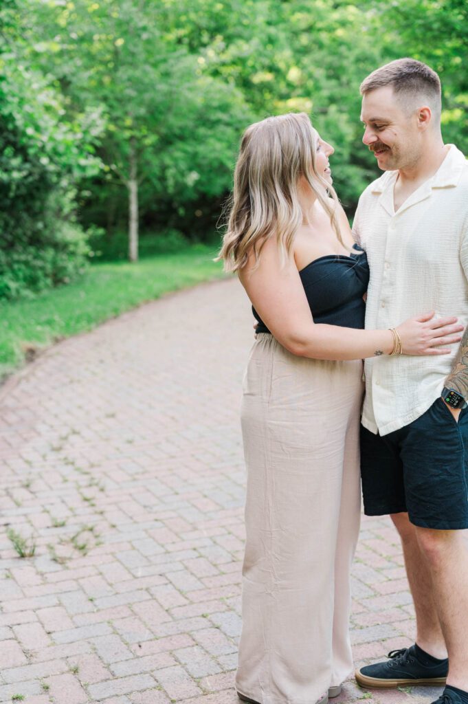 Couple smiles at each other during their photo session in Louisville