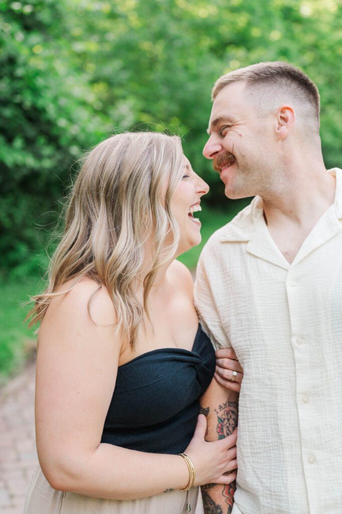 Couple shares a laugh during their photo session