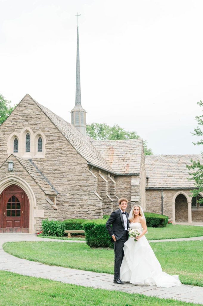 Wedding couple in front of Duncan Memorial Chapel before their ceremony