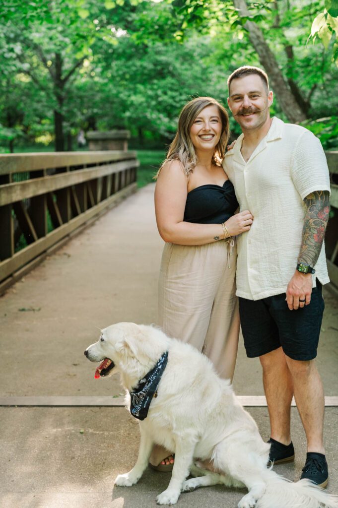 Couple smiles at the camera during their couples session in Louisville