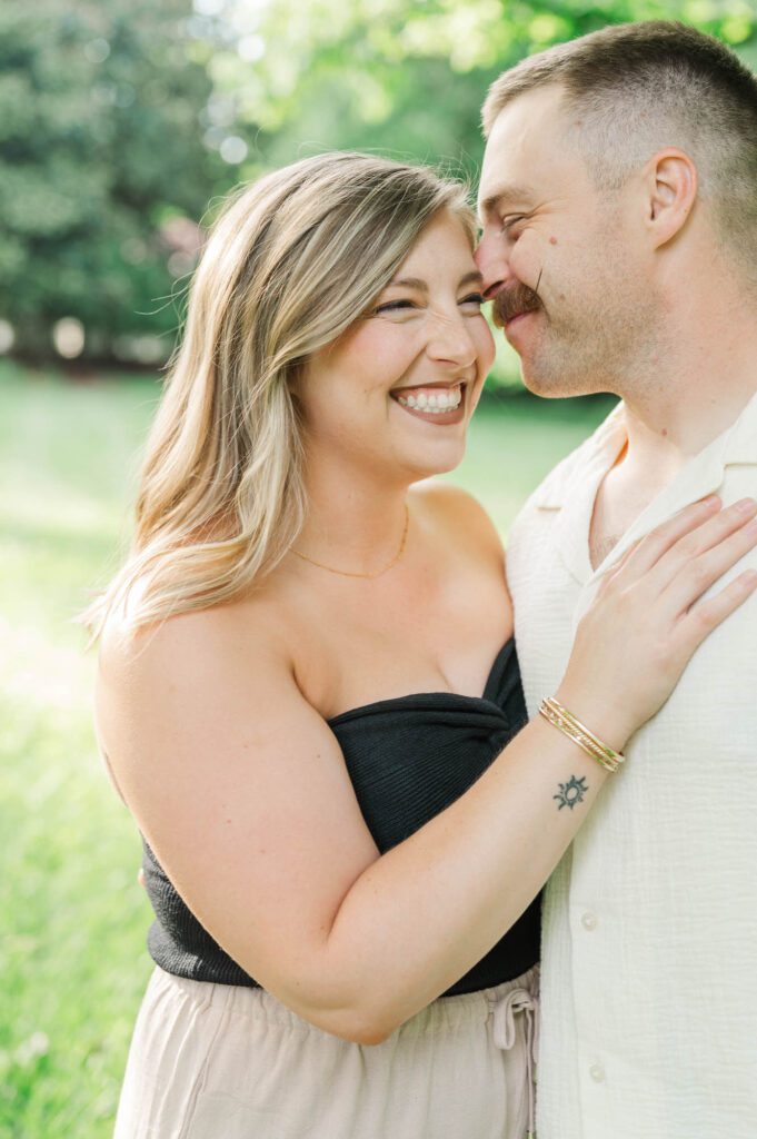 Couple smiles together during their photo session in Louisville