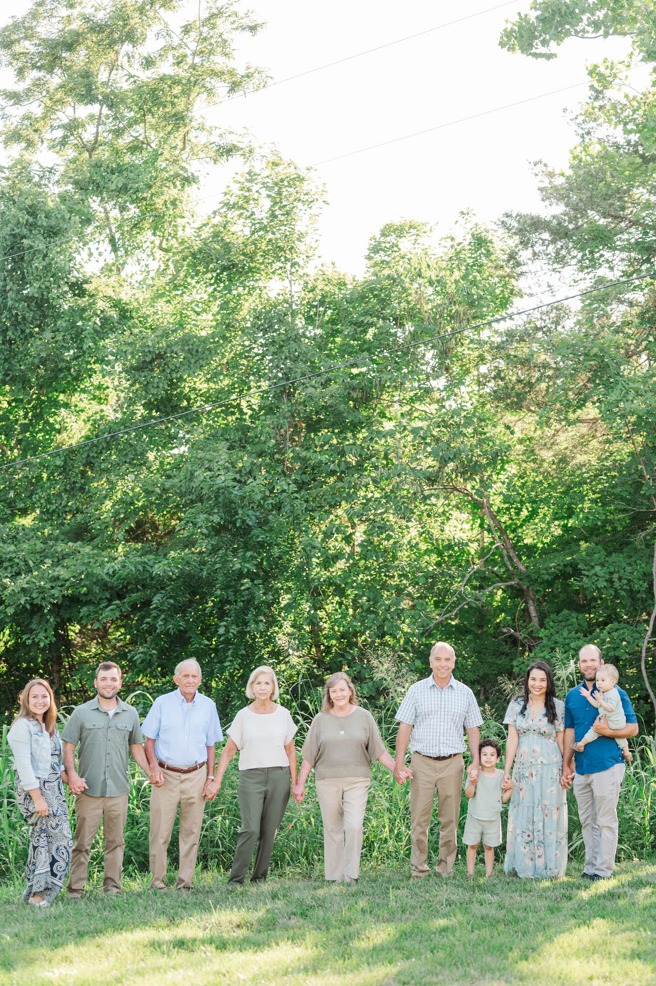 An extended family gets together on family farm for their photo session in Lexington, KY