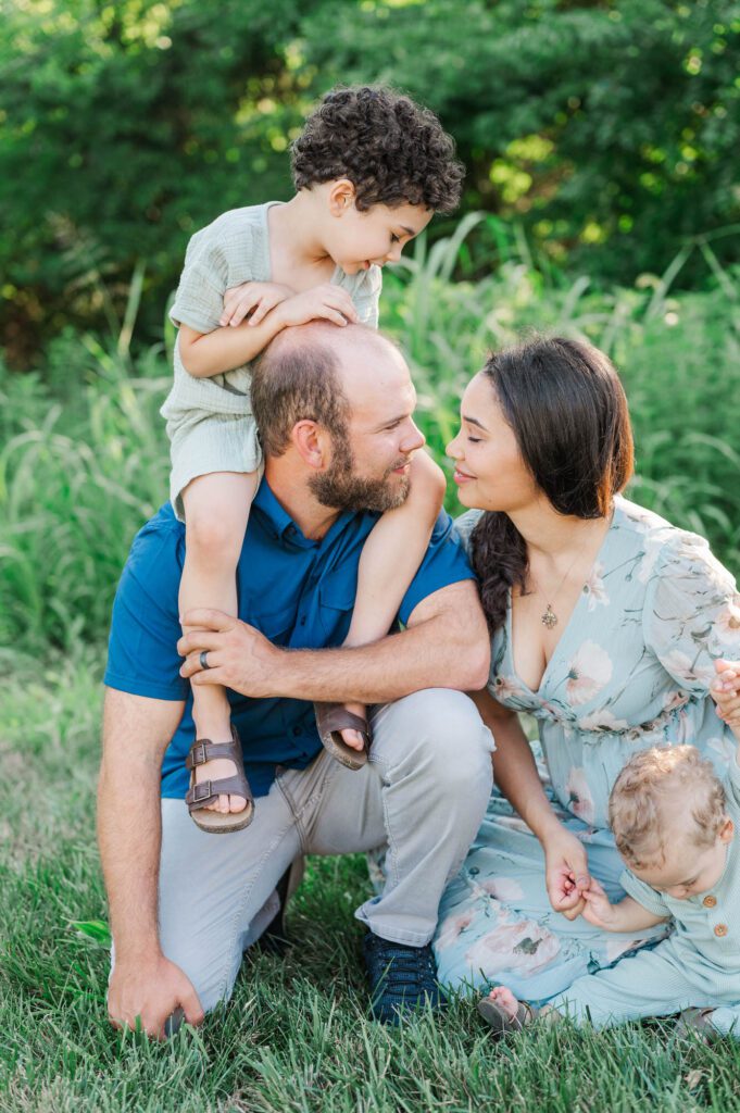 An extended family gets together on family farm for their photo session.