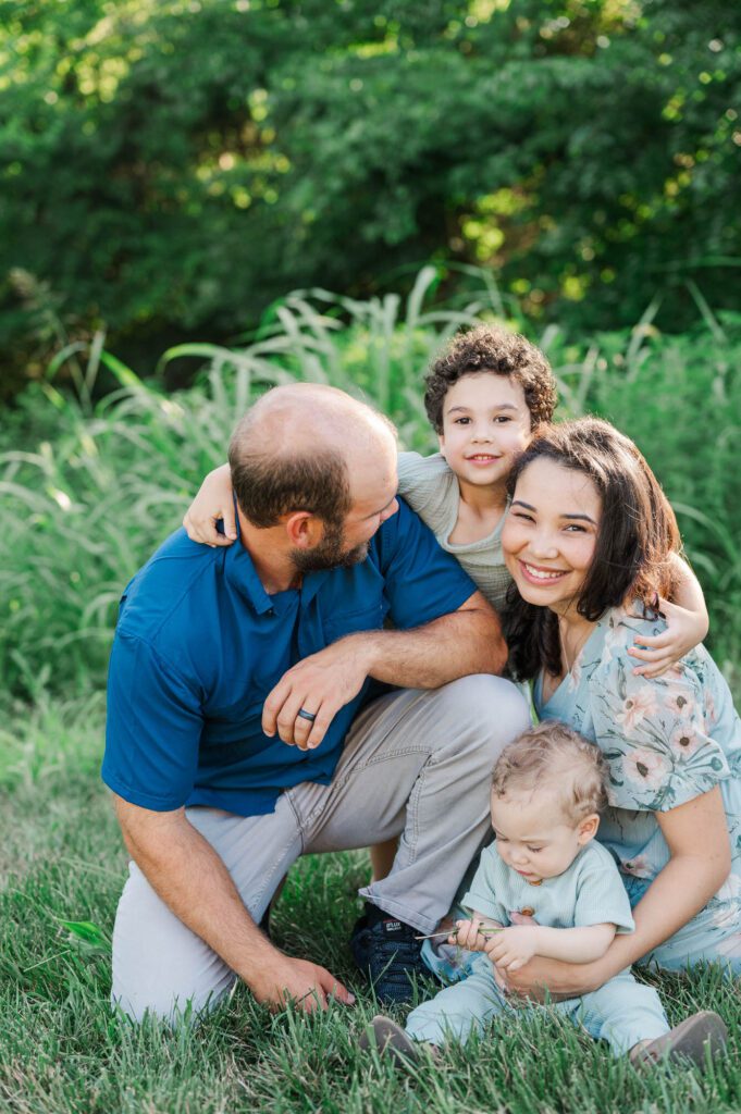 An extended family gets together on family farm for their photo session.