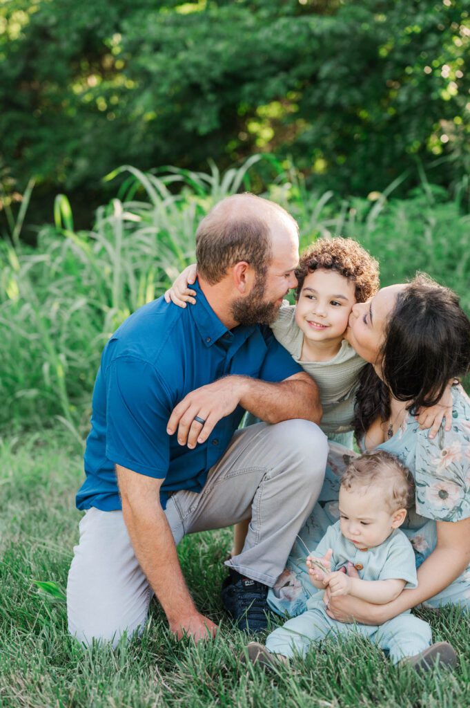 An extended family gets together on family farm for their photo session.