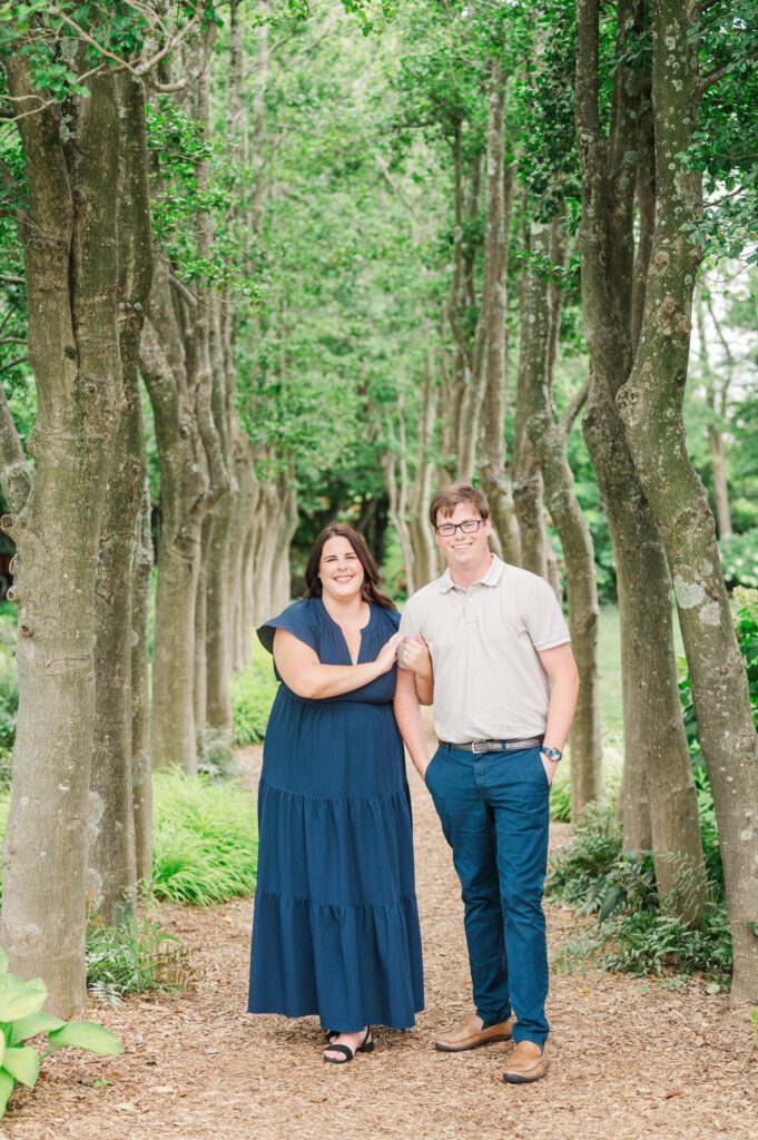 Couple stands amongst flowers at Yew Dell Botanical Gardens for their couples session in Louisville, KY