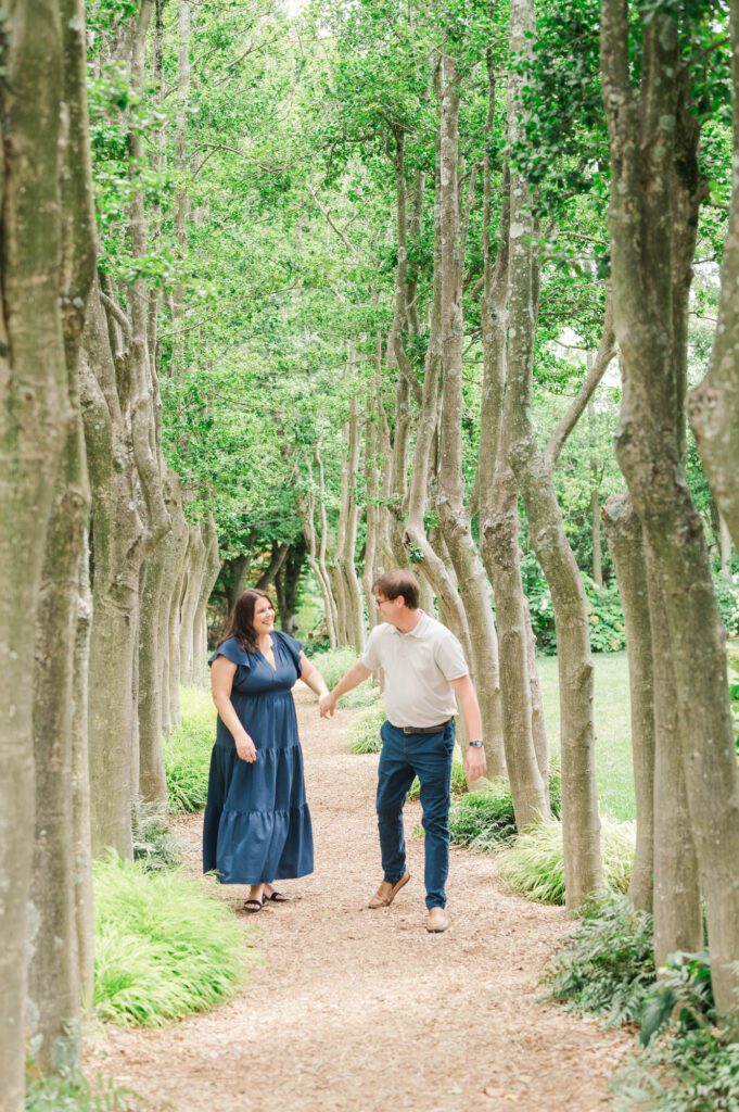 Couple stands amongst flowers at Yew Dell Botanical Gardens for their couples session in Louisville, KY