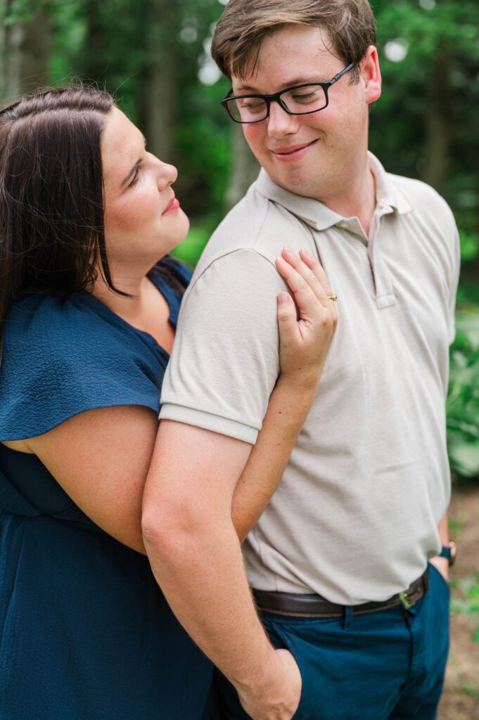 Couple stands amongst flowers at Yew Dell Botanical Gardens for their couples session in Louisville, KY