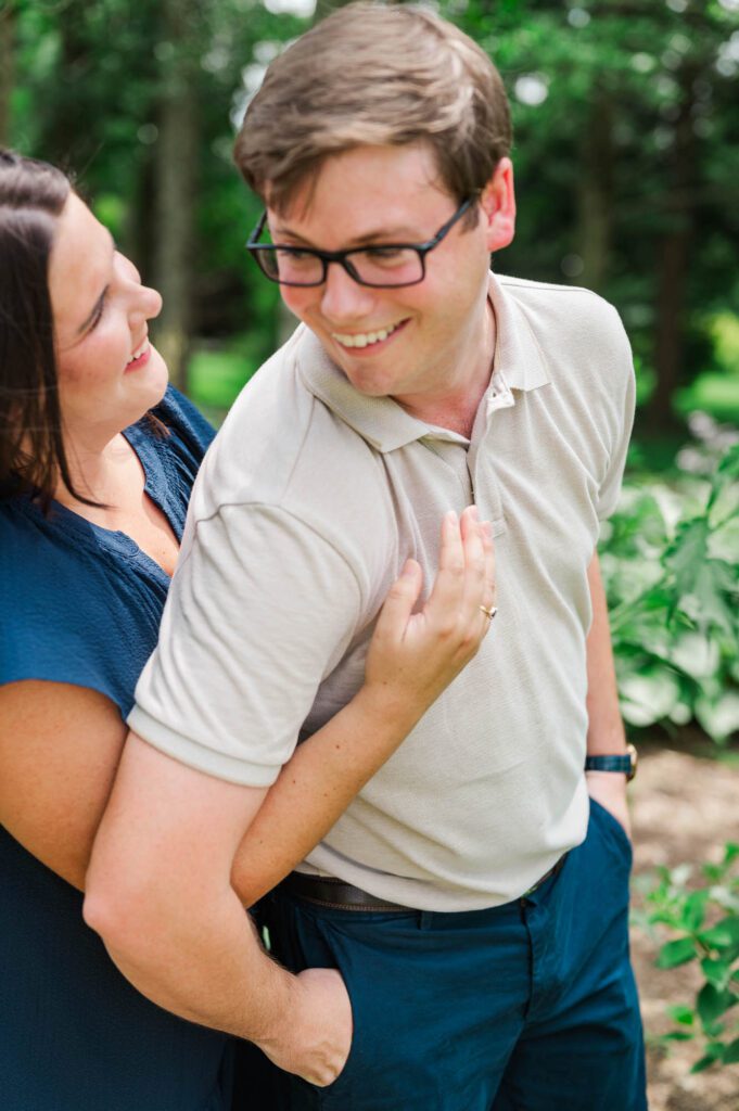 Couple stands amongst flowers at Yew Dell Botanical Gardens for their couples session in Louisville, KY