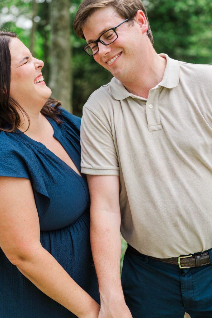 Couple stands amongst flowers at Yew Dell Botanical Gardens for their couples session in Louisville, KY