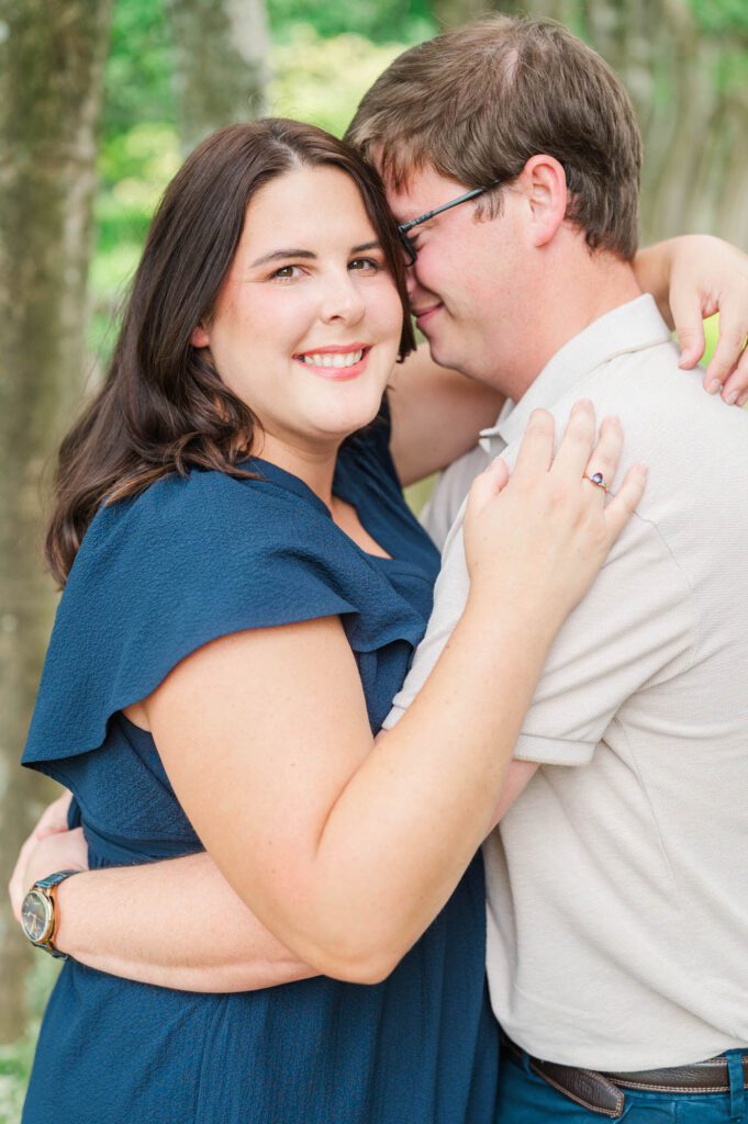 Couple stands amongst flowers at Yew Dell Botanical Gardens for their couples session in Louisville, KY