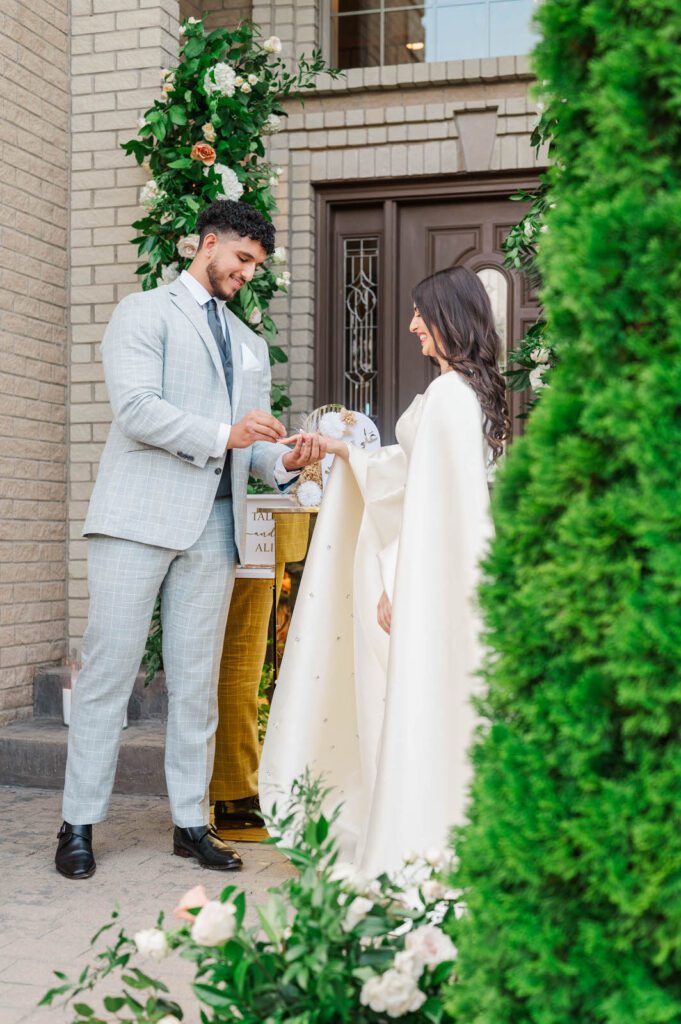 Engaged couple give each other rings during their engagement party in Louisville, KY