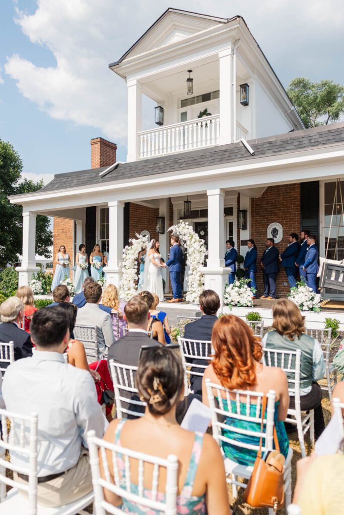 Wedding ceremony on the front porch at The Presley House Riverview in Warsaw, KY