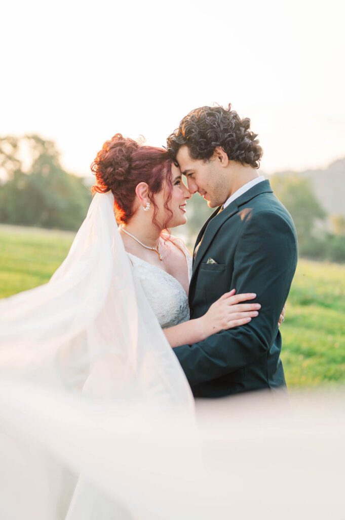 Bride and groom pose for portraits on their wedding day