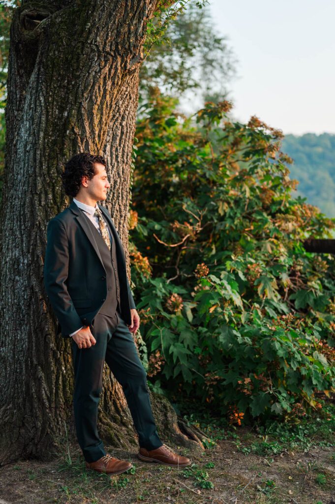 Groom looks at his bride on their wedding day at Richwood on the River