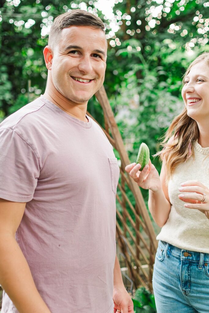 Couple standing in their home garden for their engagement session