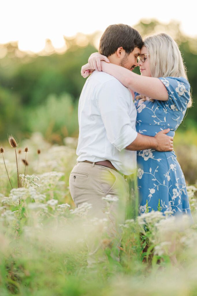 Couple stands together in Beckley Creek Park for their Louisville engagement session