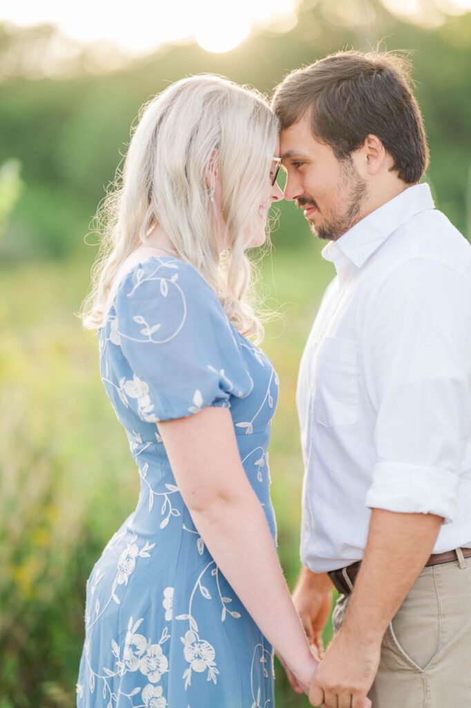 Couple stands together in Beckley Creek Park for their Louisville engagement session