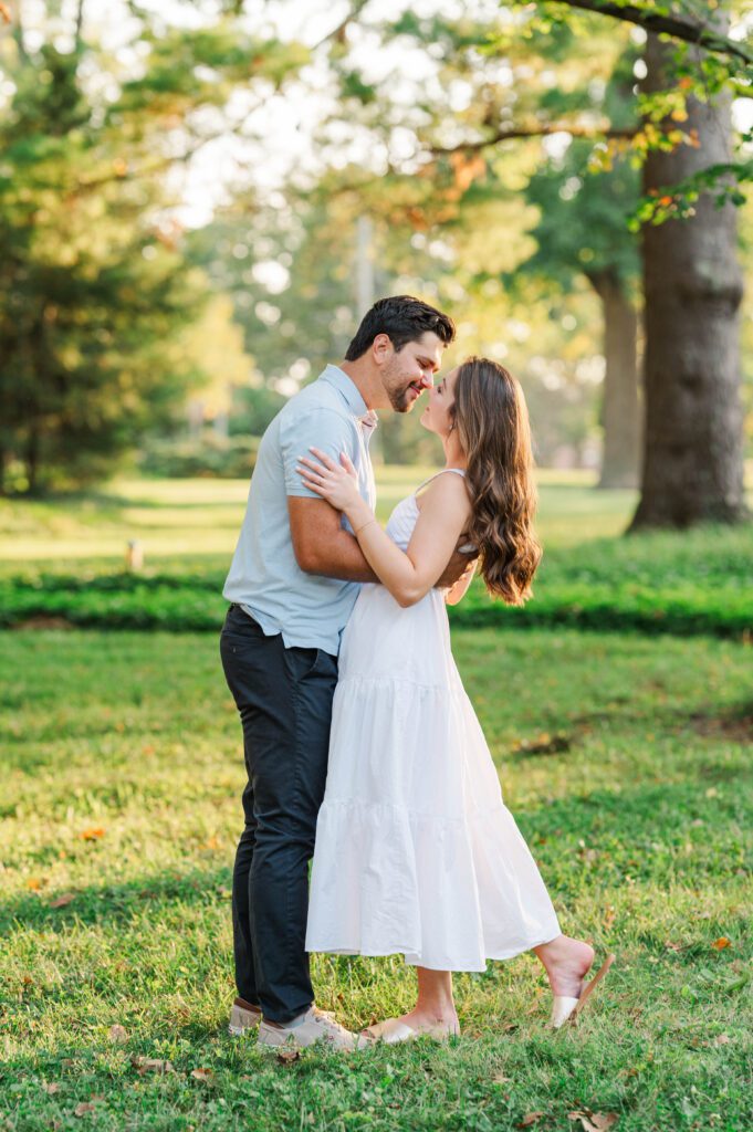 Couple shares a kiss during their engagement session at Anchorage Trail in Louisville, KY