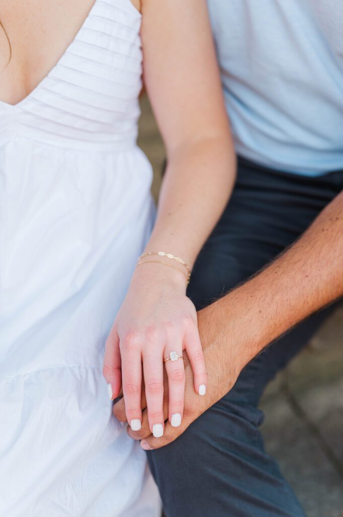 Couple holds hands during their engagement session at Anchorage Trail in Louisville, KY