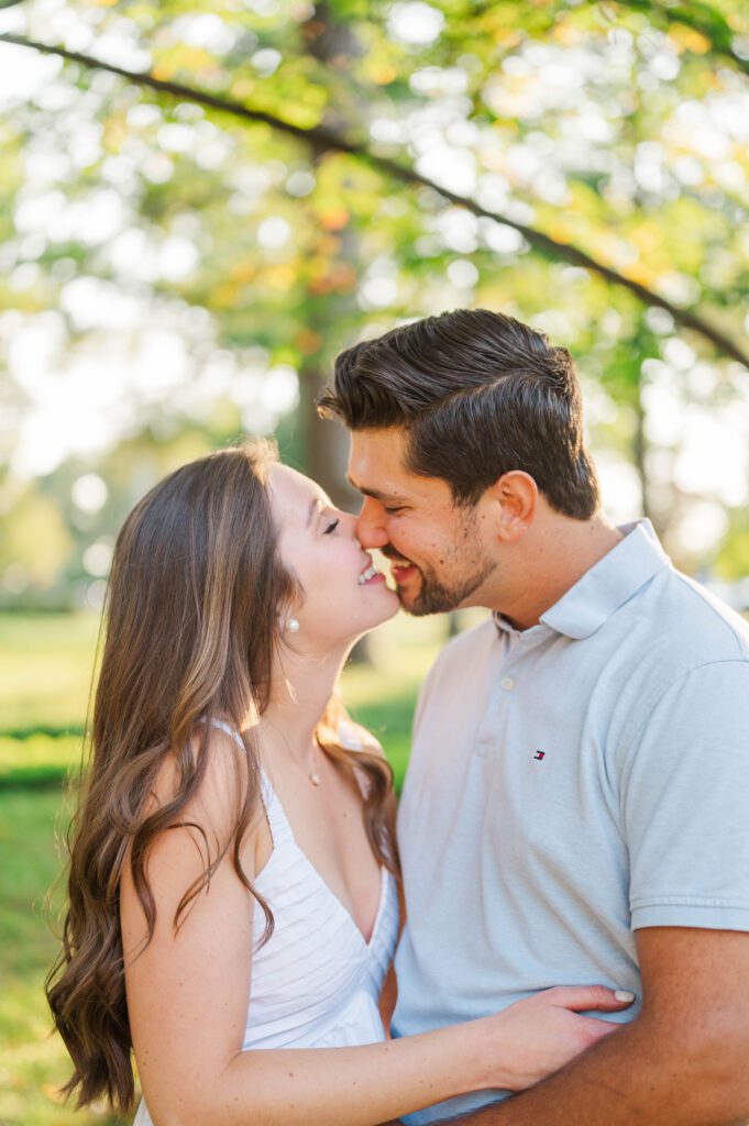 Couple smiles at each other during their engagement session at Anchorage Trail in Louisville, KY