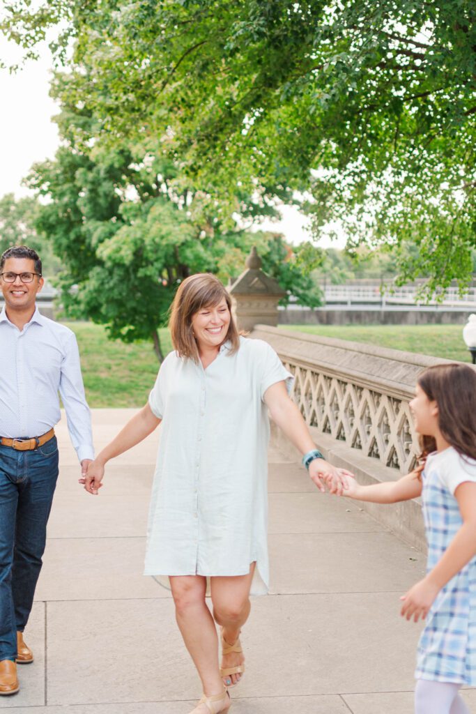 Family stands together on the stairs to the Crescent Hill Reservoir