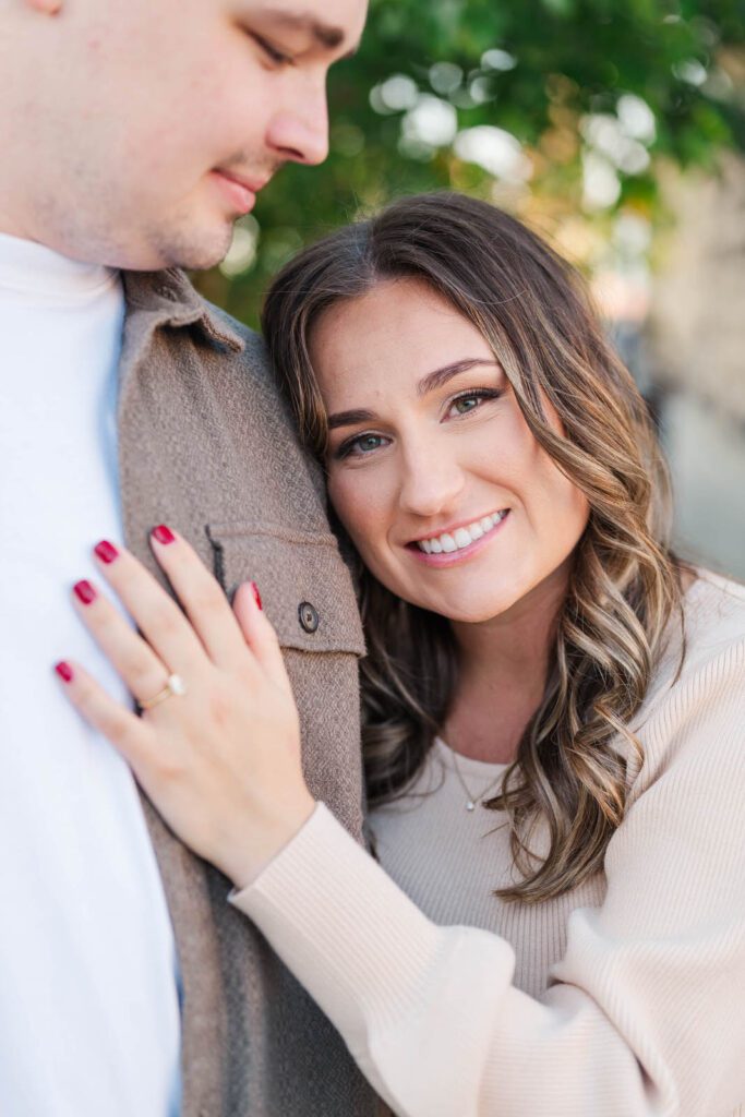 Couple stands together at Roebling Bridge for their Cincinnati engagement photos