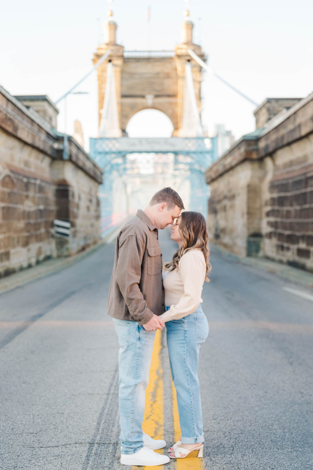 Couple sits together on the Hamilton County Courthouse steps for their Cincinnati engagement session