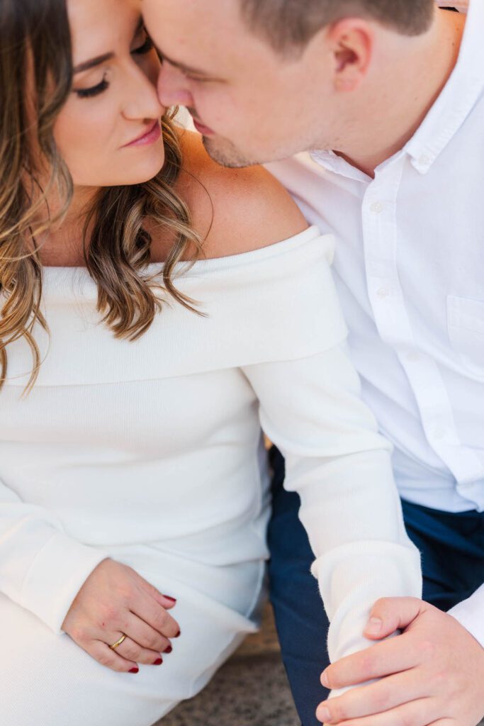 Couple sits together on the Hamilton County Courthouse steps for their Cincinnati engagement session