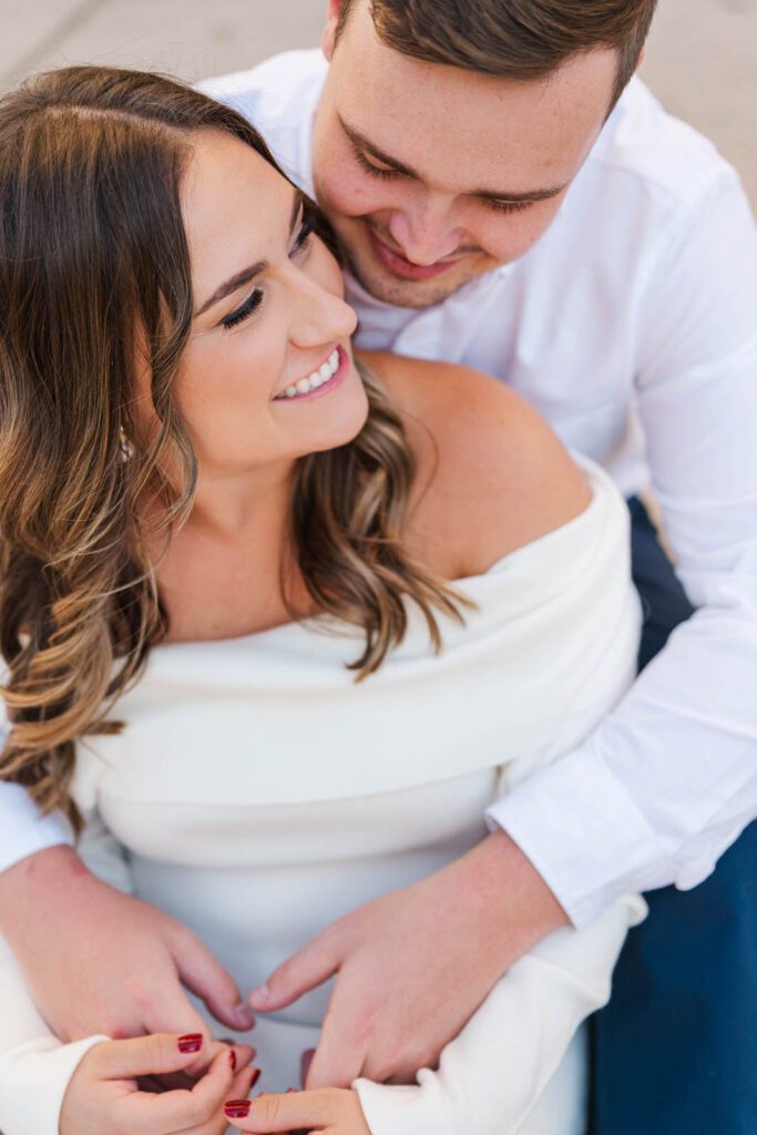 Couple sits together on the Hamilton County Courthouse steps for their Cincinnati engagement session