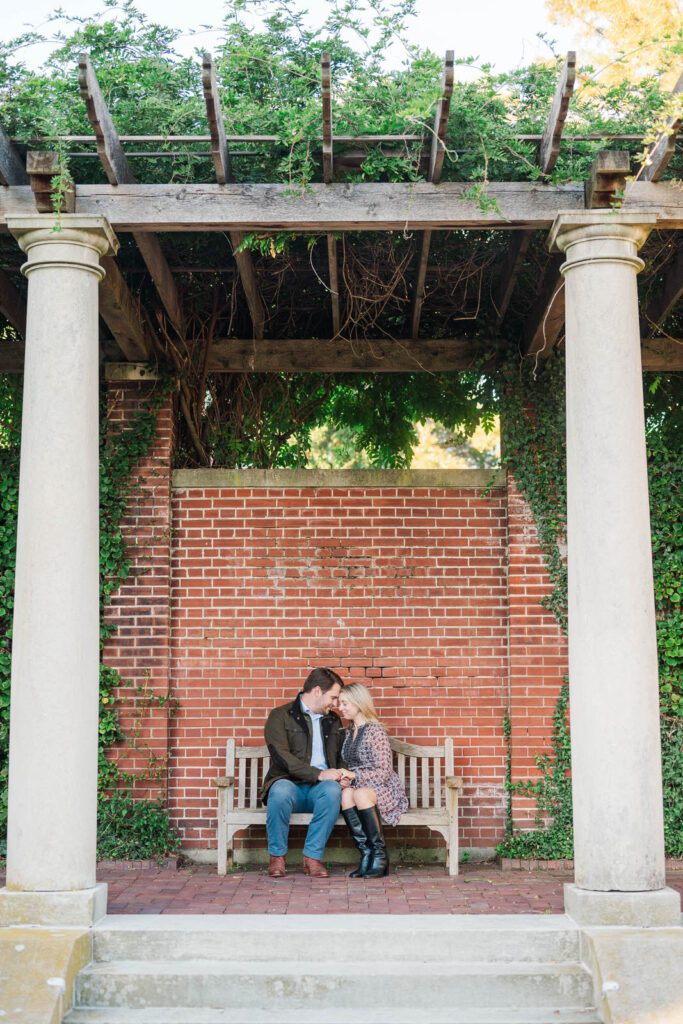 Couple sits on a bench at Gardencourt in Louisville, KY